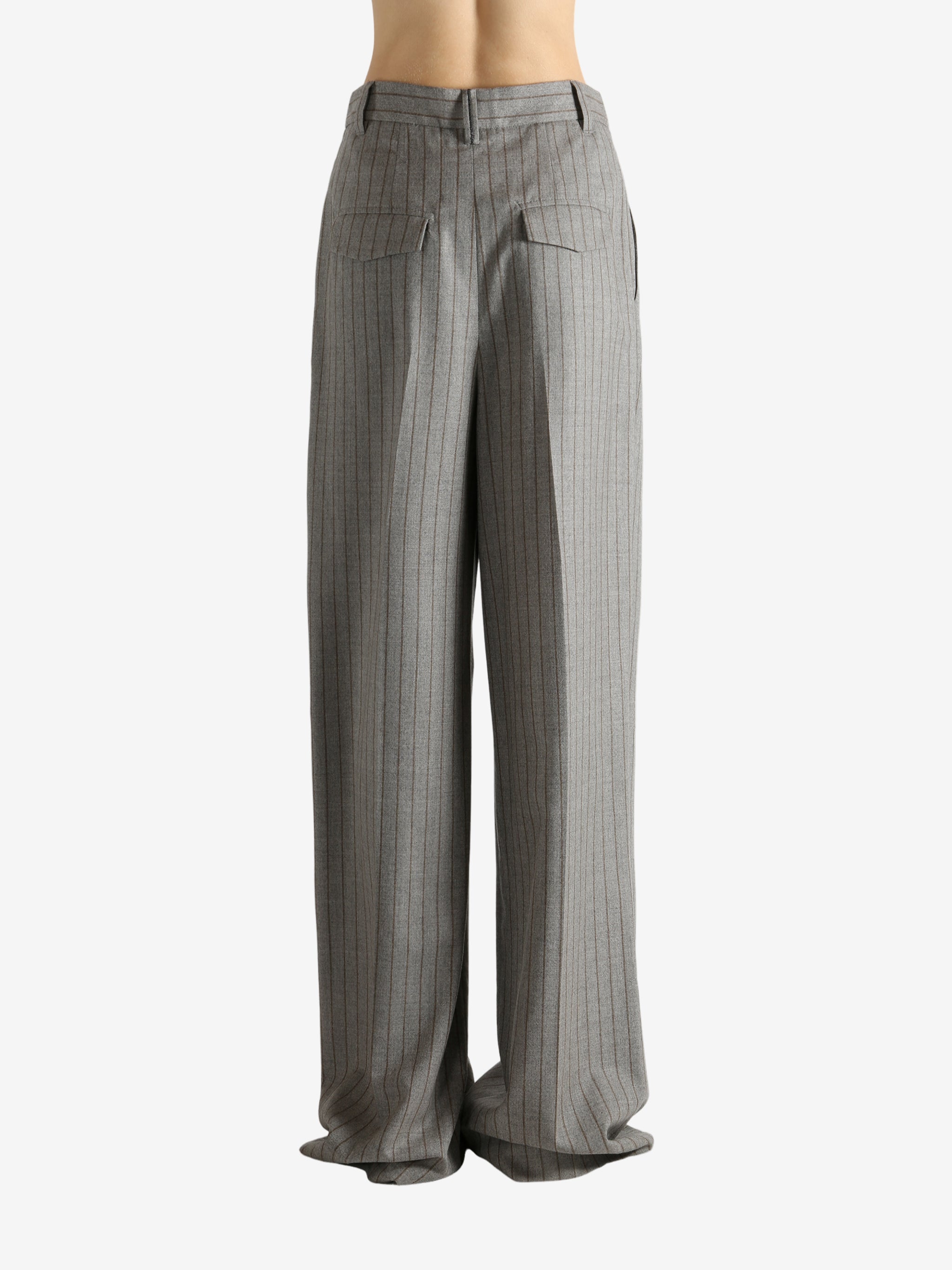 Grey pants worn by a person, showing the pants fit