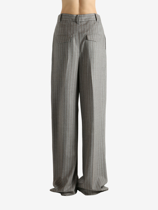 Grey pants worn by a person, showing the pants fit