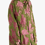 green jackets-coats worn by a person, showing the jackets-coats fit