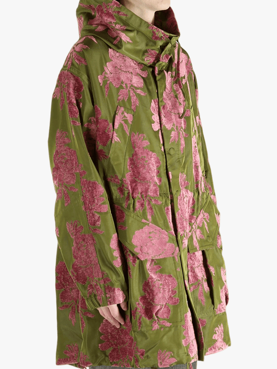 green jackets-coats worn by a person, showing the jackets-coats fit