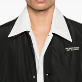 Close up of the black jacket, showing texture of the polyester fabric