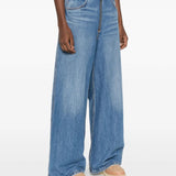 Blue jeans worn by a person, showing the jeans' fit