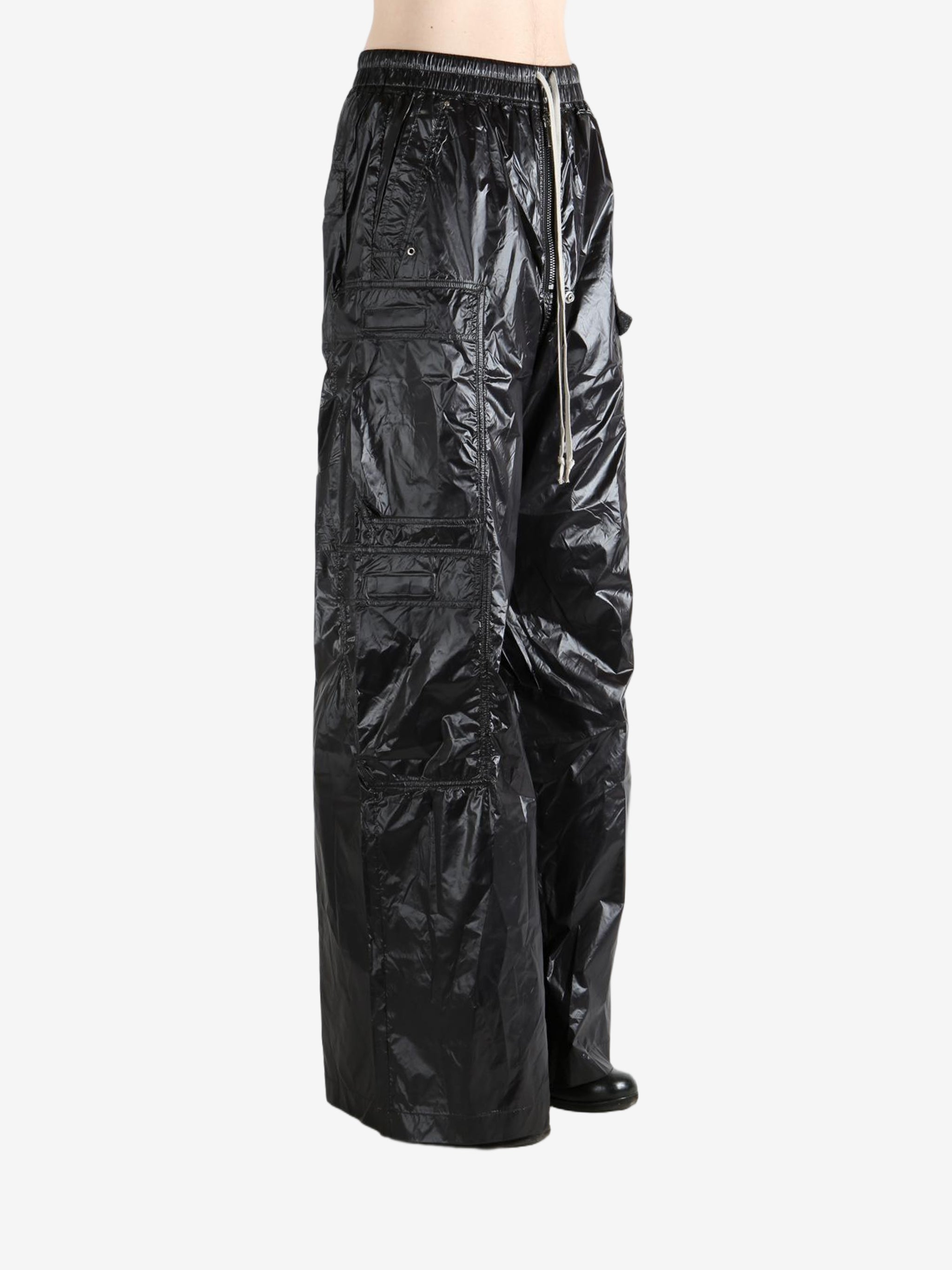 Black pants worn by a person, showing the pants' fit