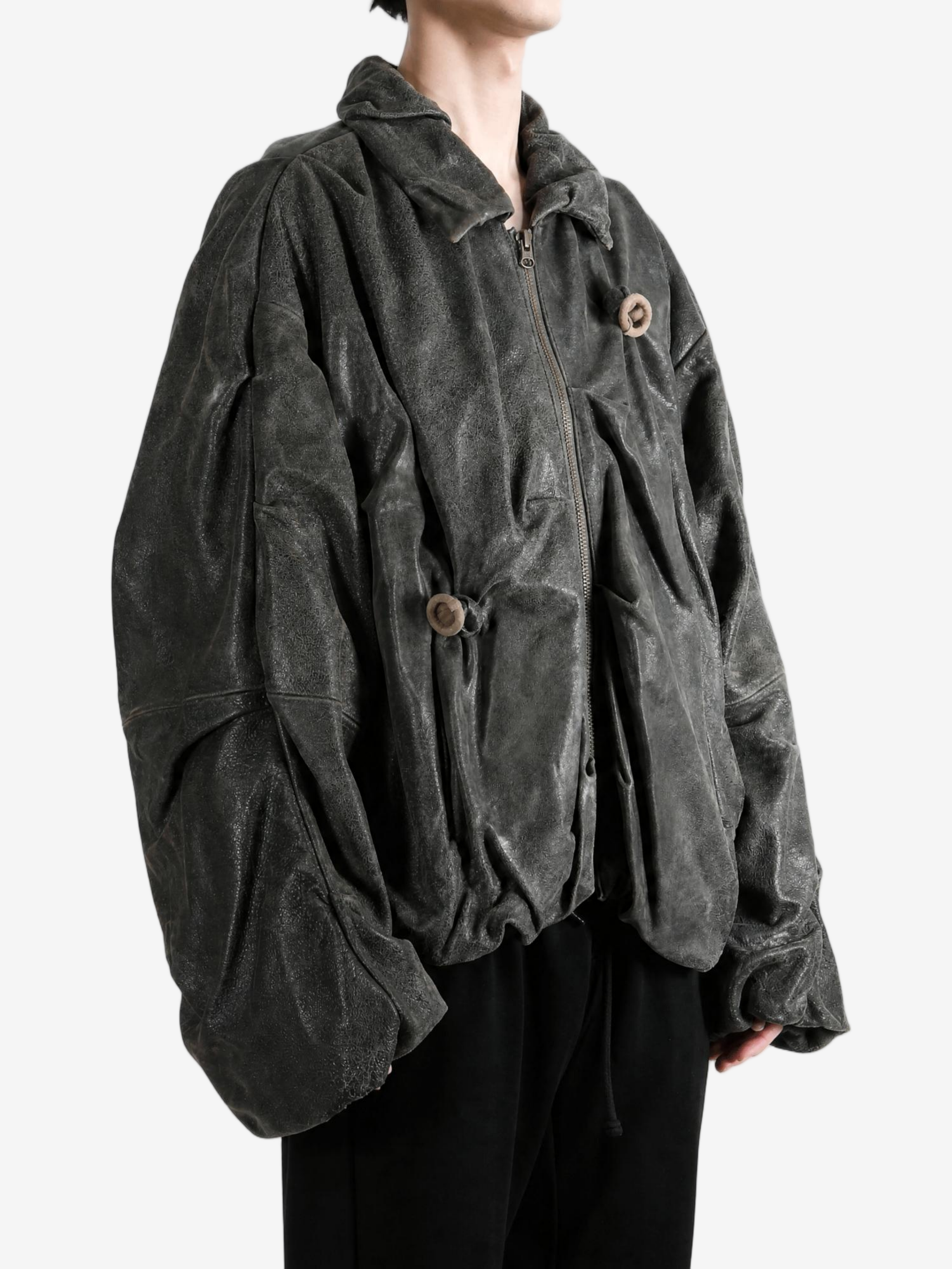 Black jacket worn by a person, showing the jacket fit