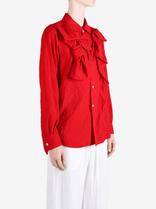 Red shirt worn by a person, showing the shirt fit