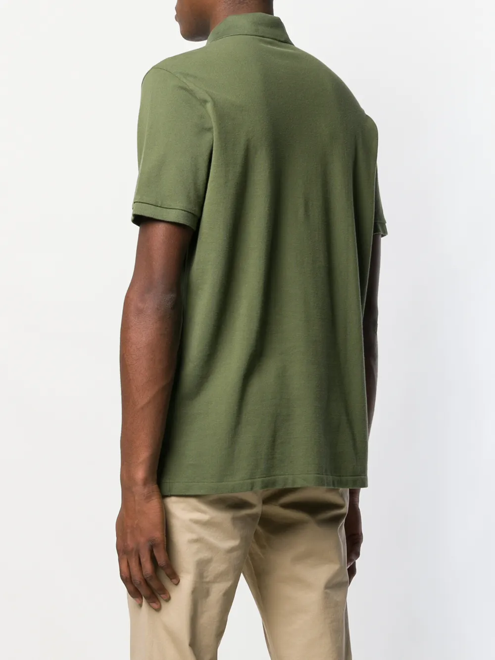 Green t-shirt worn by a person, showing the t-shirt fit