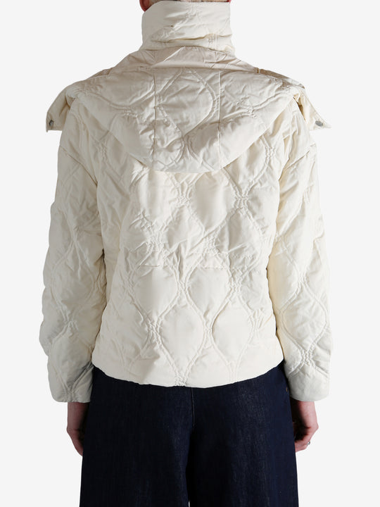 White jacket worn by a person, showing the jacket's fit
