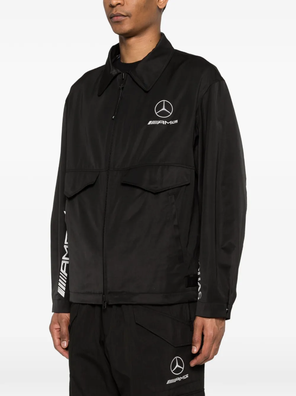 Black jacket worn by a person, showing the jacket's fit