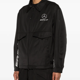 Black jacket worn by a person, showing the jacket's fit