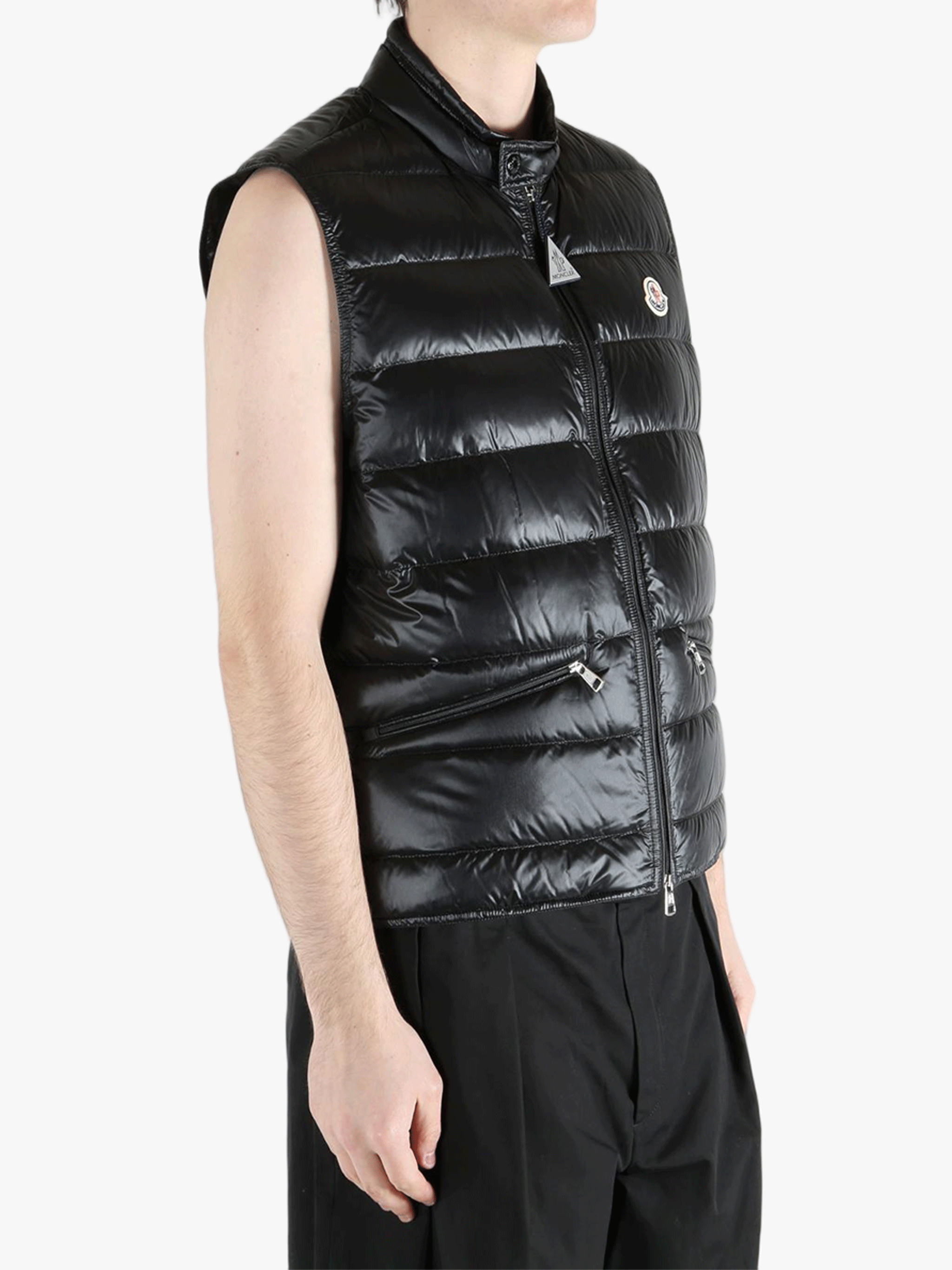 Black top worn by a person, showing the top's fit