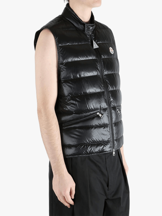 Black top worn by a person, showing the top's fit