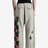 Grey pants worn by a person, showing the pants fit