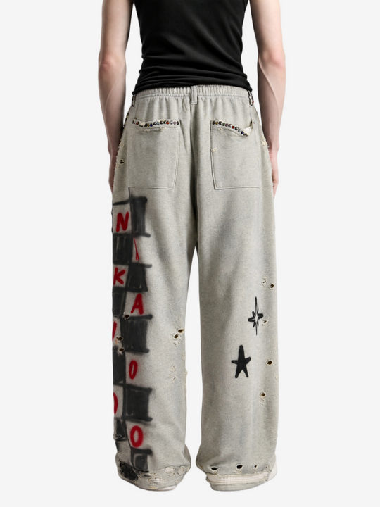 Grey pants worn by a person, showing the pants fit