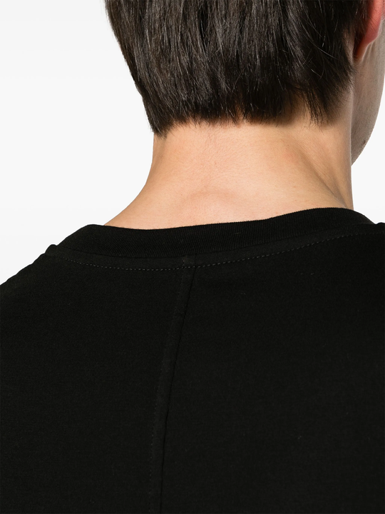 Close up of black t-shirt, showing texture of the cotton fabric
