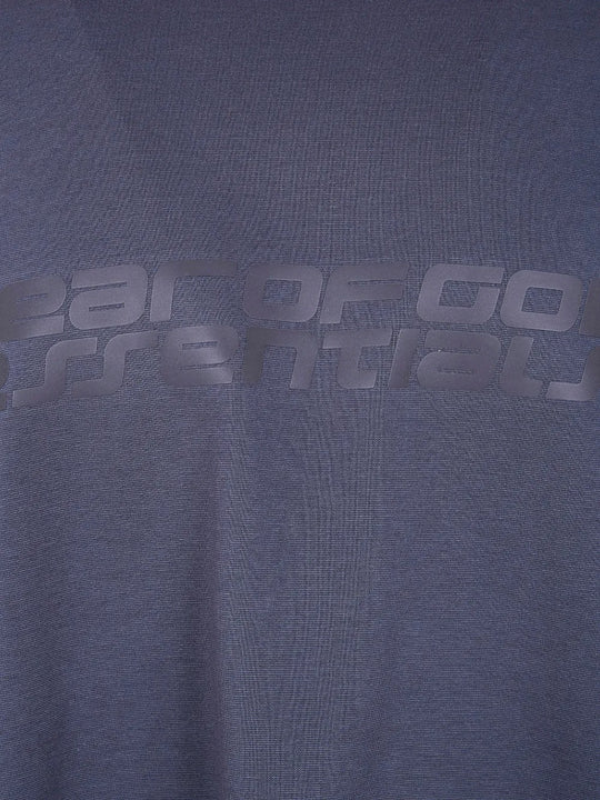 Close up of blue t-shirt, showing the texture of the cotton fabric