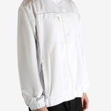 White jacket worn by a person, showing the jacket's fit