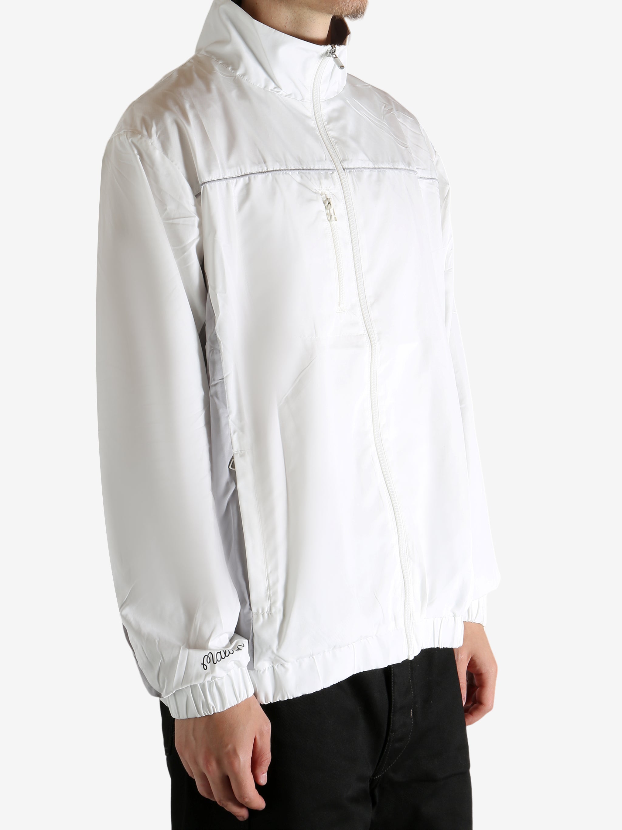 White jacket worn by a person, showing the jacket's fit