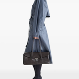 Black bag worn by a person, showing the bag's fit