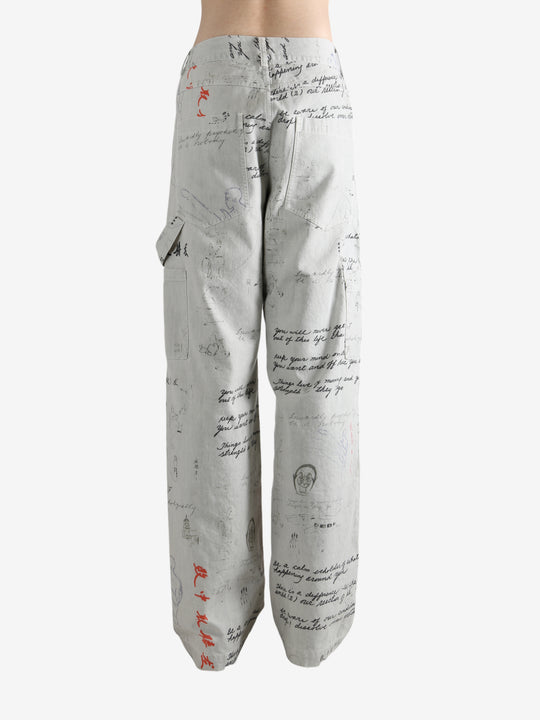 Grey pant worn by a person, showing the pant's fit