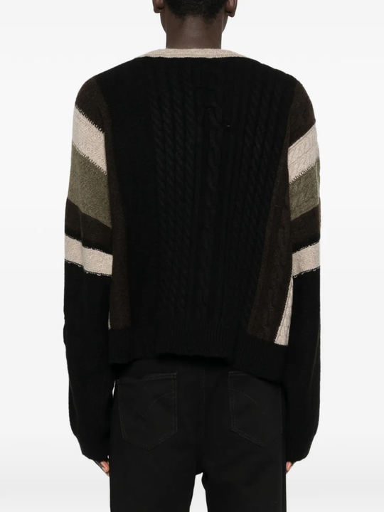 Black sweater worn by a person, showing the sweater fit