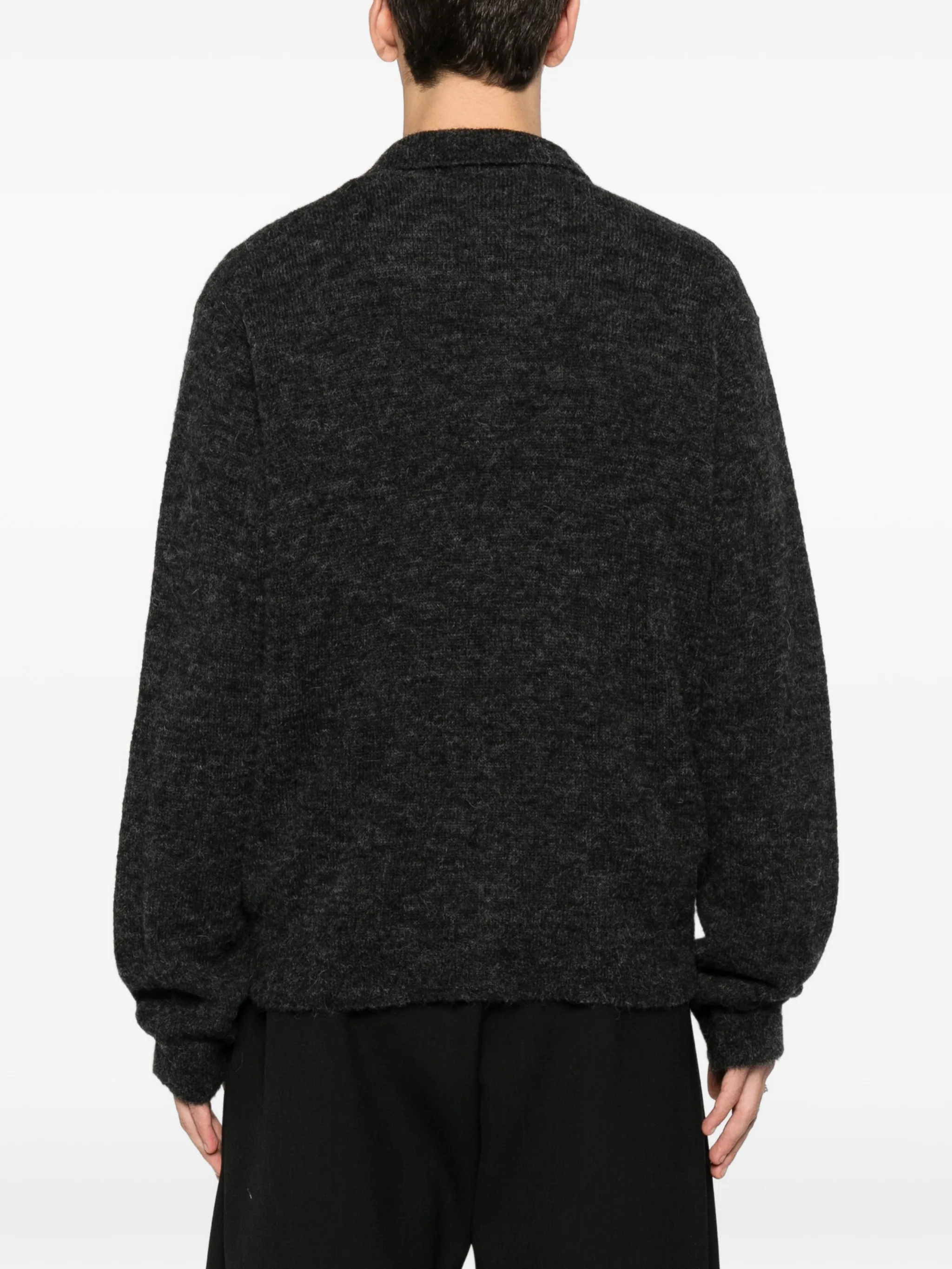 grey shirt worn by a person, showing the shirt fit