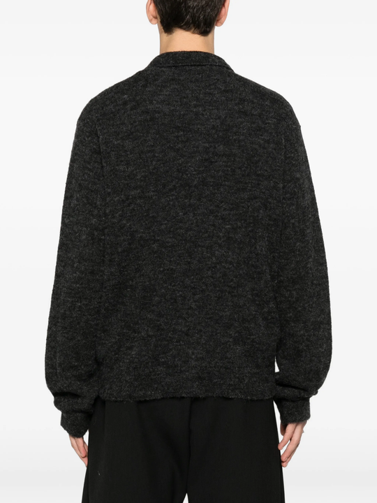 grey shirt worn by a person, showing the shirt fit