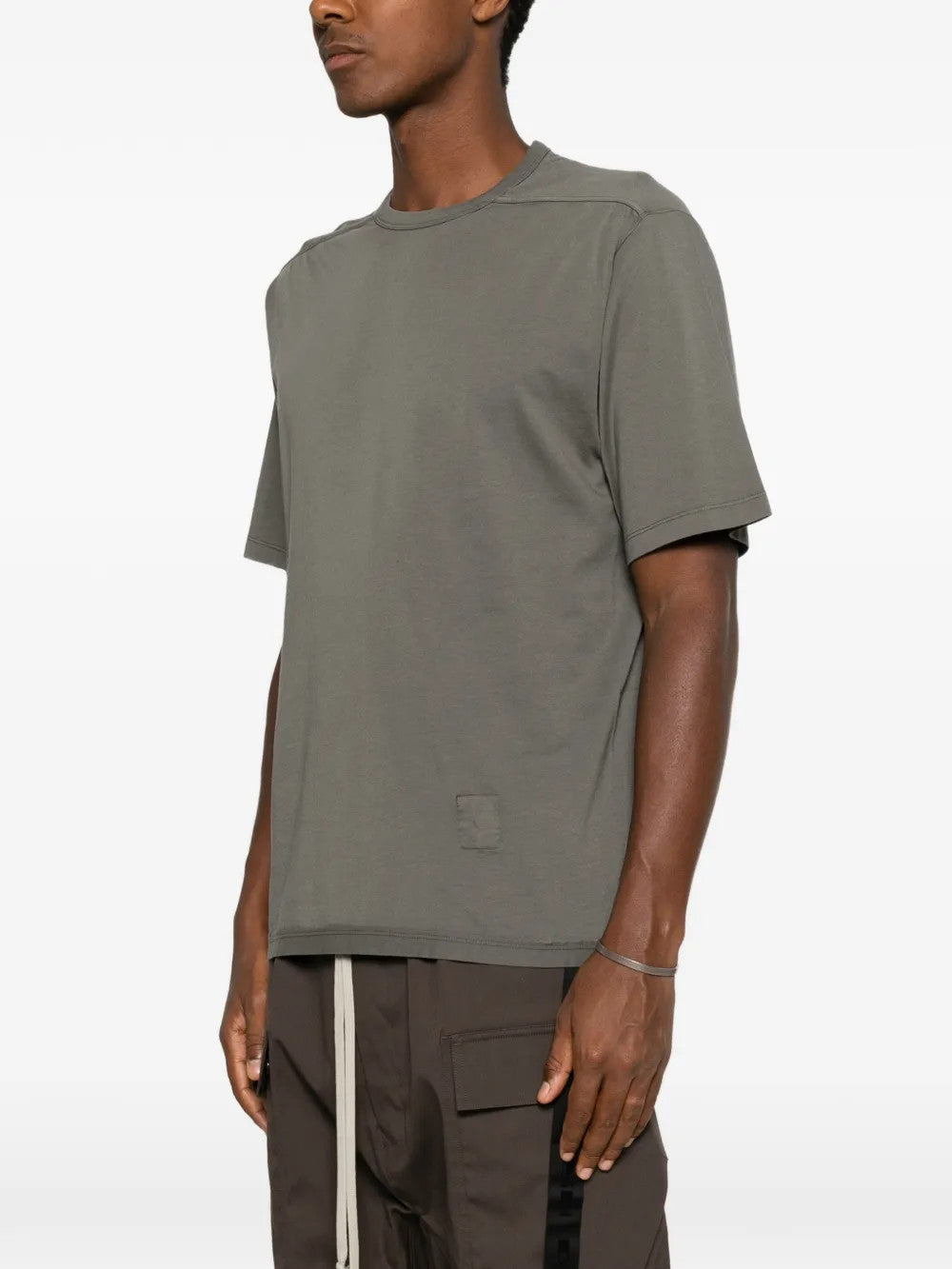 Grey t-shirt worn by a person, showing the t-shirt fit