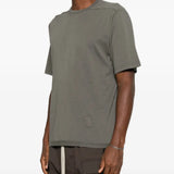 Grey t-shirt worn by a person, showing the t-shirt fit