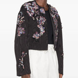 Black jacket worn by a person, showing the jacket fit