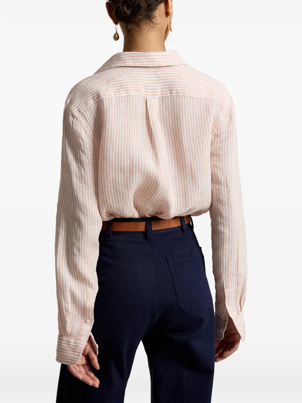 Pink knitwear worn by a person, showing the knitwear fit