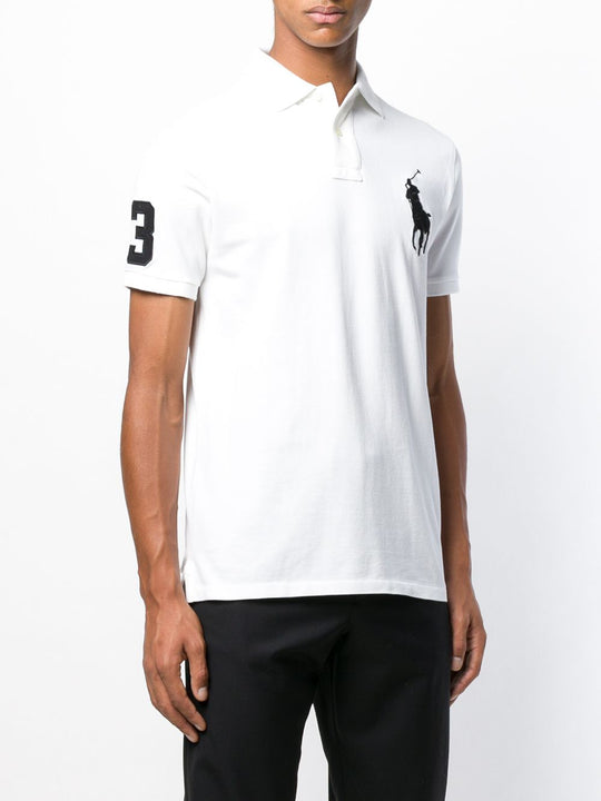 White shirt worn by a person, showing the shirt fit