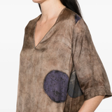 Brown dress worn by a person, showing the dress's fit