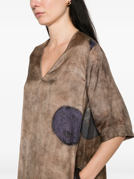 Brown dress worn by a person, showing the dress's fit