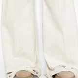 Close up of White pant, showing texture of the cotton fabric