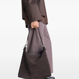 Brown bag worn by a person, showing the bag fit