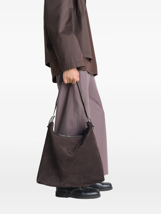 Brown bag worn by a person, showing the bag fit
