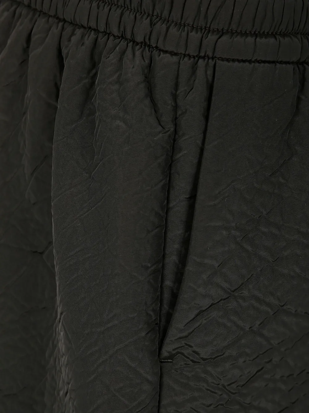 Close up of the black short, showing texture of the polyester fabric