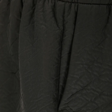 Close up of the black short, showing texture of the polyester fabric