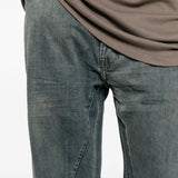 Blue pants worn by a person, showing the pants fit