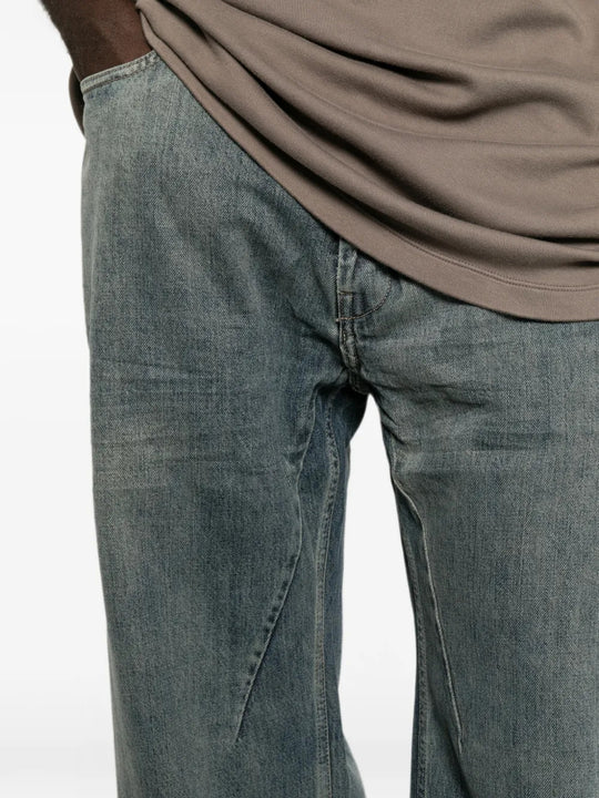 Blue pants worn by a person, showing the pants fit