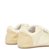 Close up of tan sneakers,showing texture of the cotton fabric