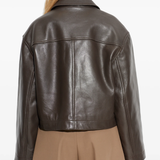 Brown jacket worn by a person, showing the jacket fit