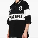 Black T-shirt worn by a person, showing the t-shirt's fit