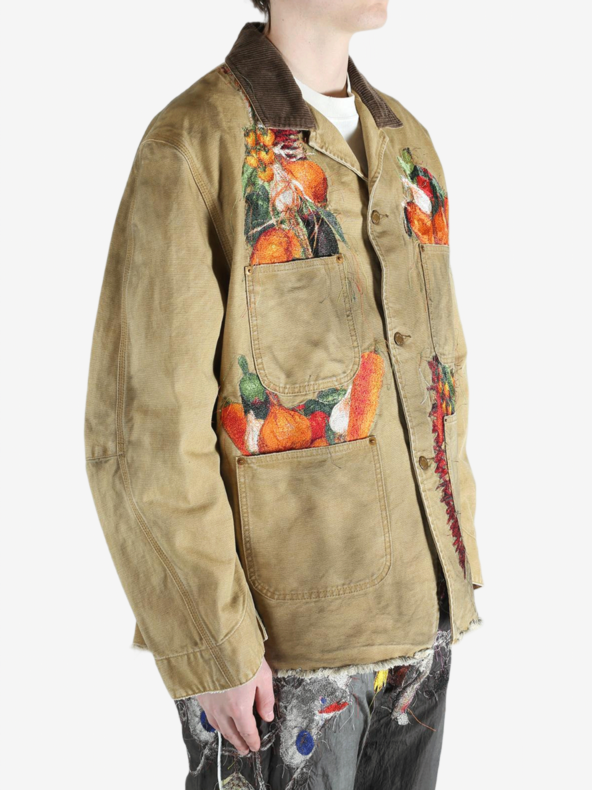 Tan jacket worn by a person, showing the jacket's fit