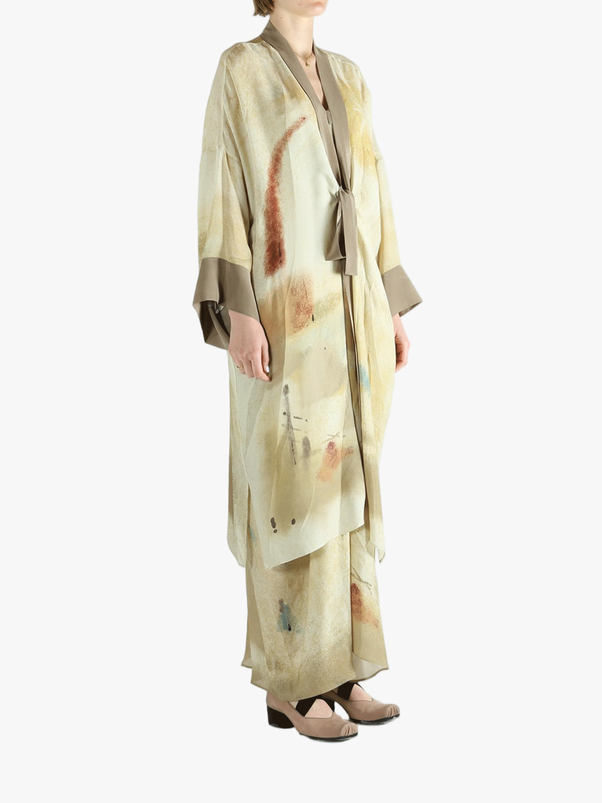 Tan top worn by a person, showing the top's fit