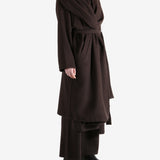 Brown coat worn by a person, showing the coat fit