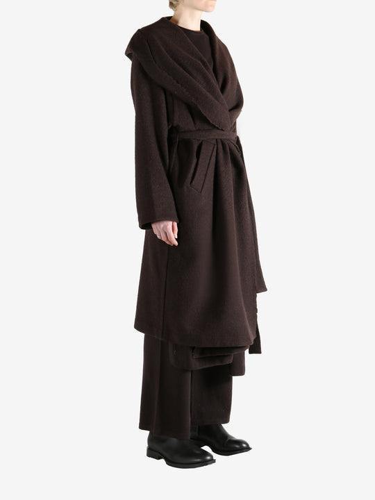 Brown coat worn by a person, showing the coat fit