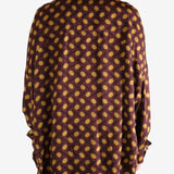 Brown shirt worn by a person, showing the shirt's fit