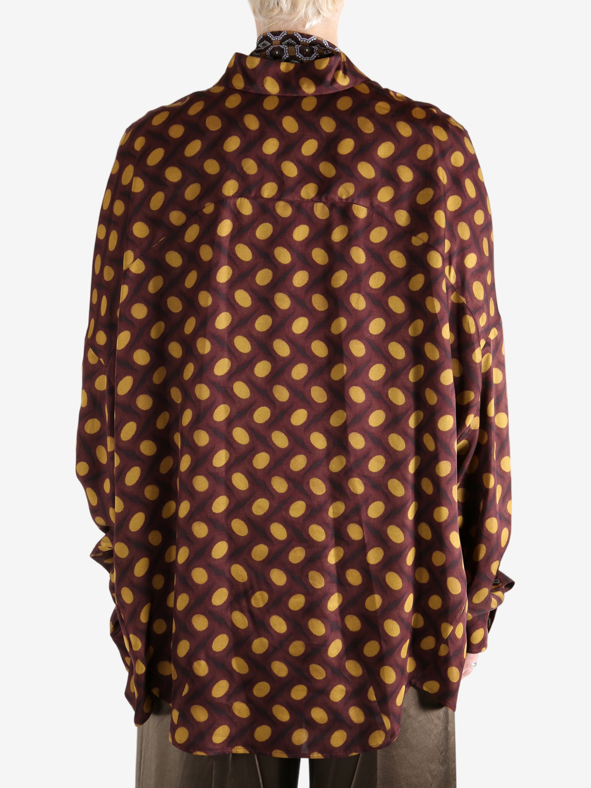 Brown shirt worn by a person, showing the shirt's fit