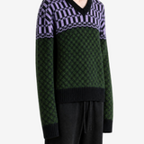 Green knitwear worn by a person, showing the knitwear fit